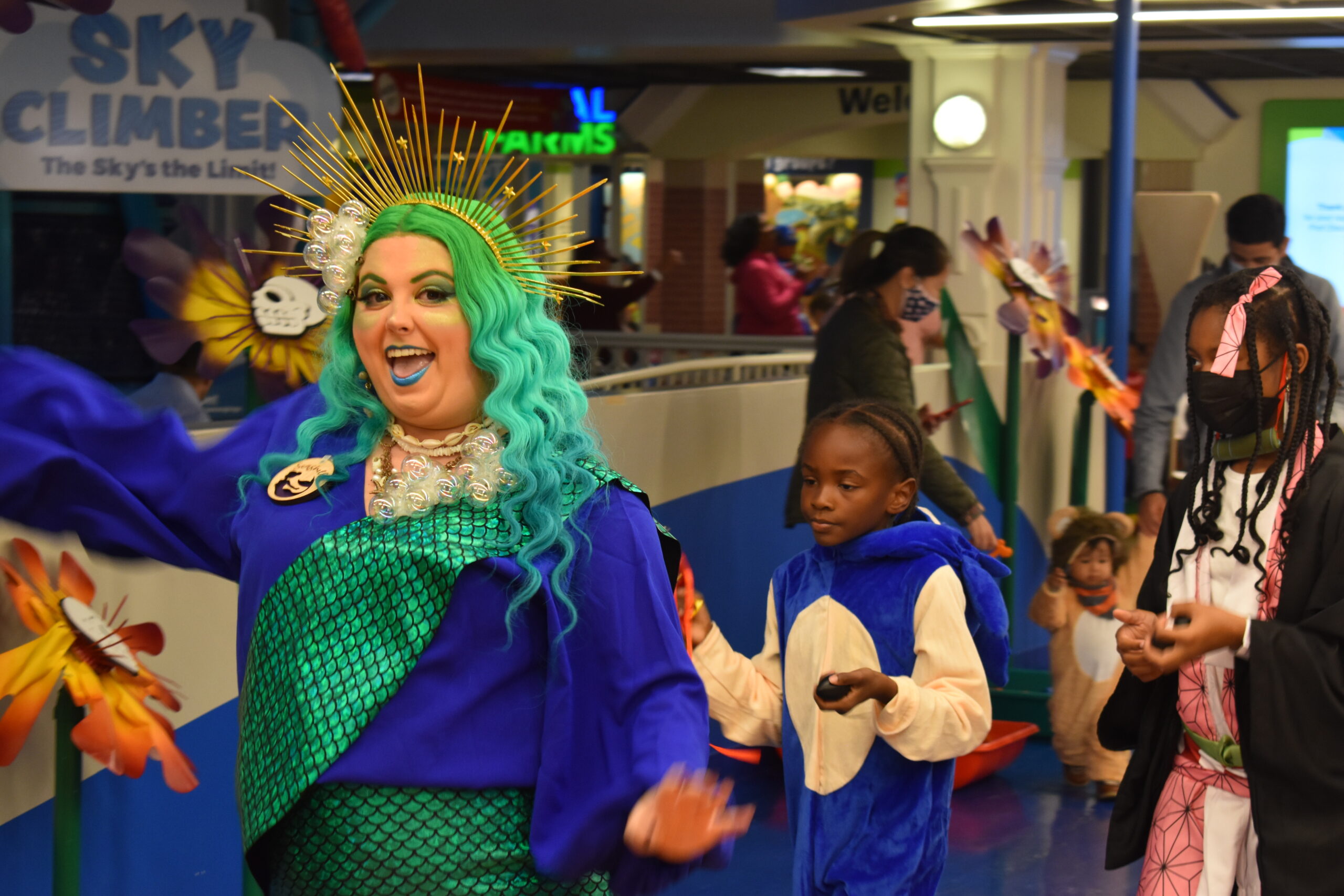 A special halloween costume parade led by a staff member dressed as a mermaid